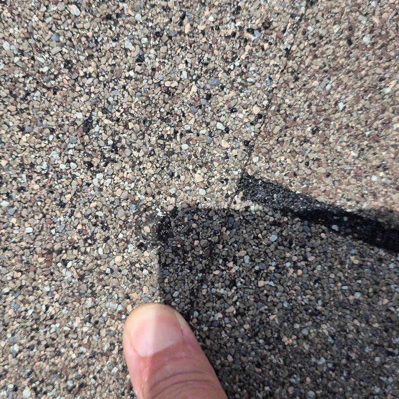 Asphalt shingle roof granule loss from hail impact