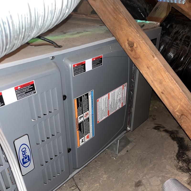 Air handler system with surge protector installed in attic