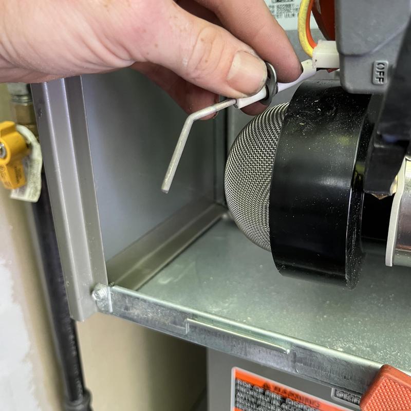 Furnace flame sensor maintenance and adjustment