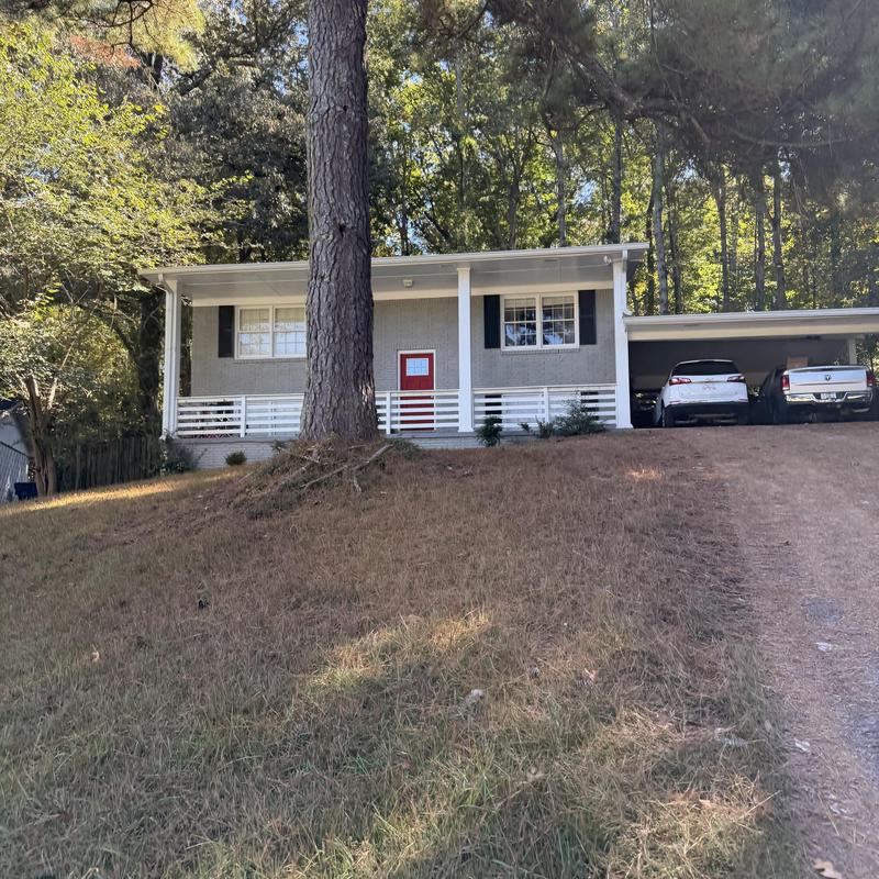 Gutter inspection on single-story home exterior