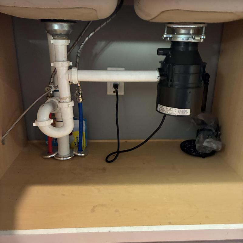 Garbage disposal and under-sink plumbing installation