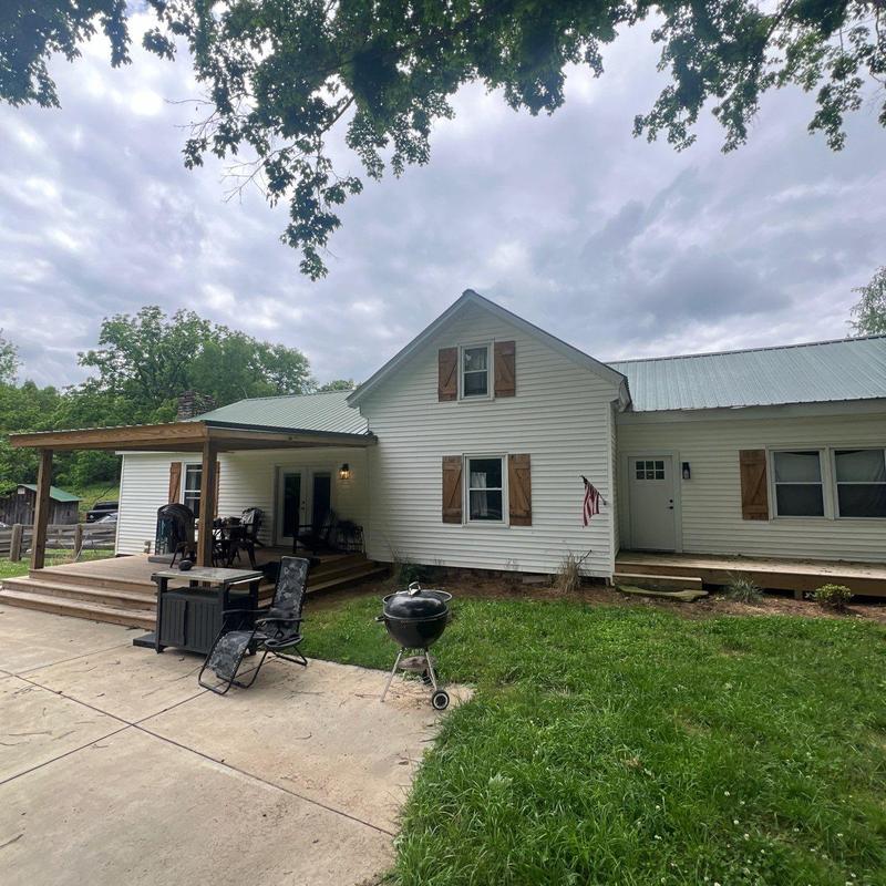 Metal roof inspection and leak repair on home exterior