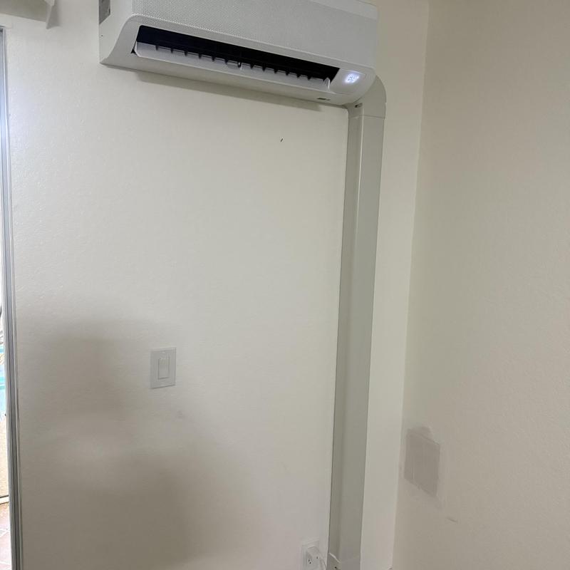 Ductless Mini Split AC unit with conduit installed indoors
