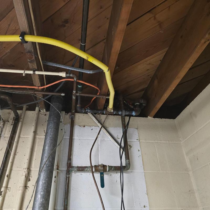 Gas line rerouted through attic to boiler and water heater