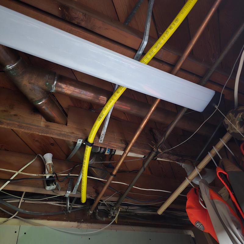 Gas line rerouted through attic to boiler and water heater