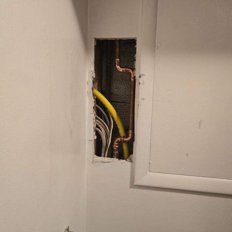 Copper gas line piping rerouted through attic space