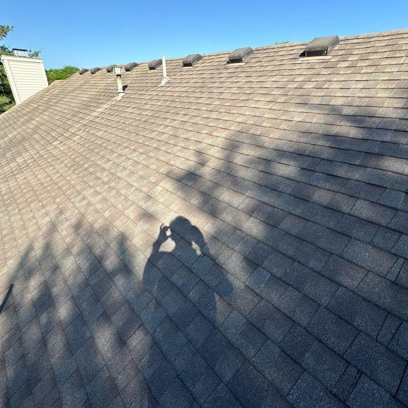 Asphalt shingle roof with roof vents and chimney