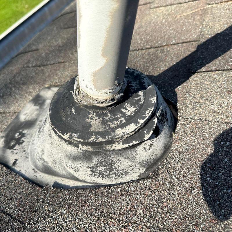 Roof pipe flashing with worn sealant and weathering
