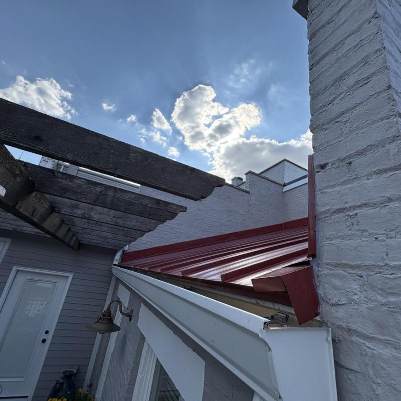 Red Everloc snap lock standing seam roof with flashing