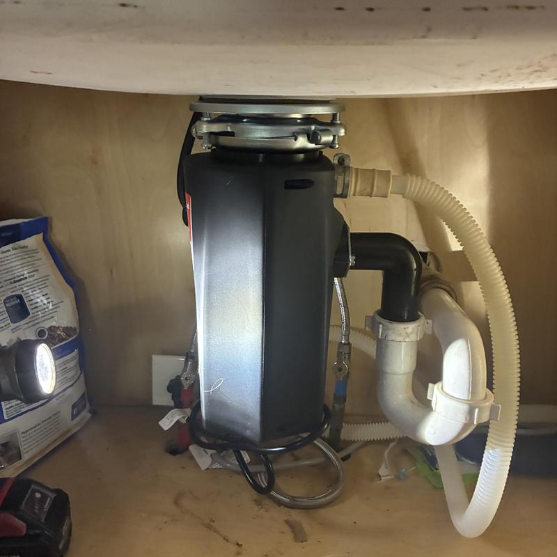 Garbage disposal installation under kitchen sink