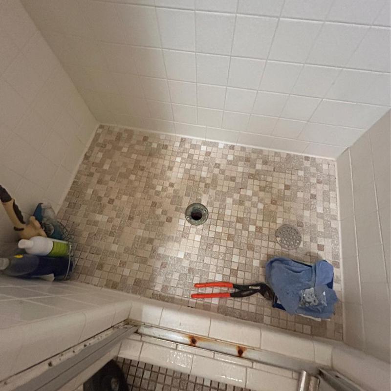 Shower drain blockage repair with tools and cloth