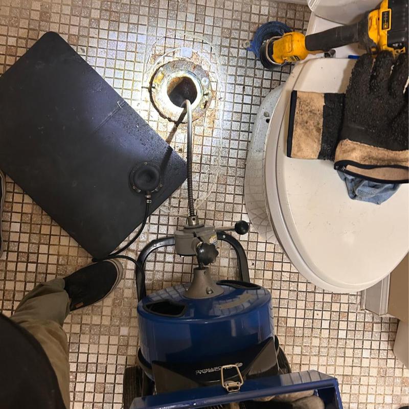 Toilet drain blockage with plumbing inspection camera