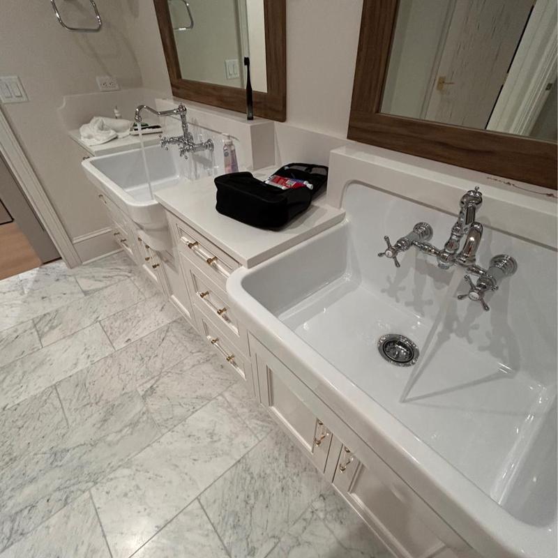 Porcelain utility sinks with running water and tools