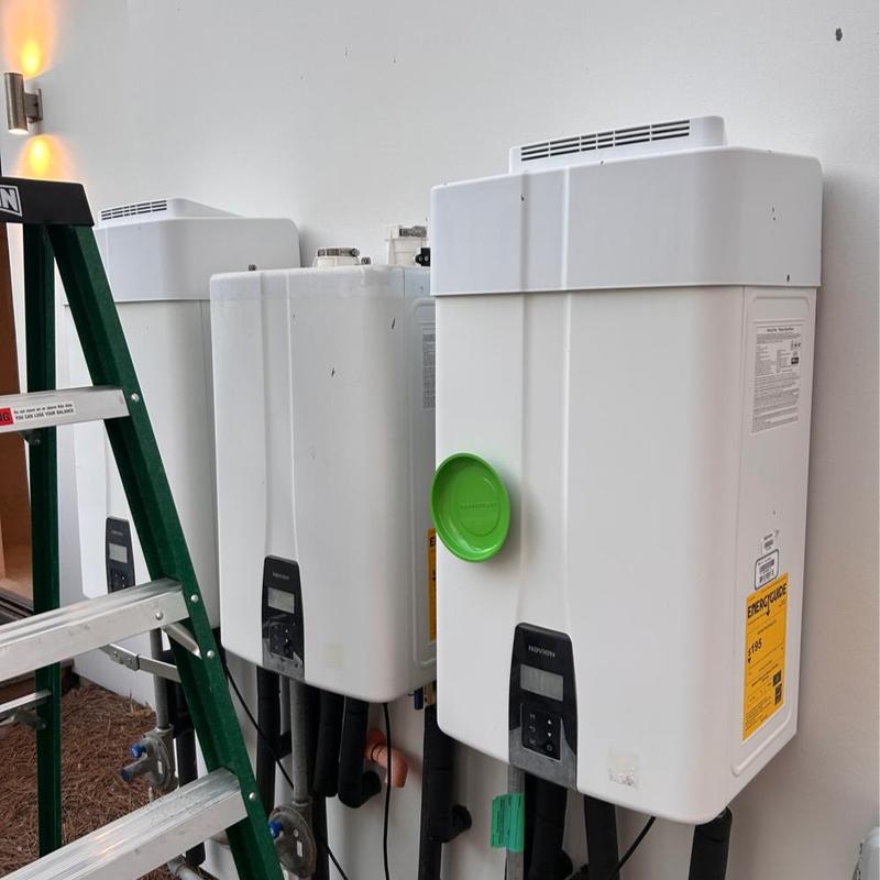 Tankless water heaters with vent exhaust cleaning