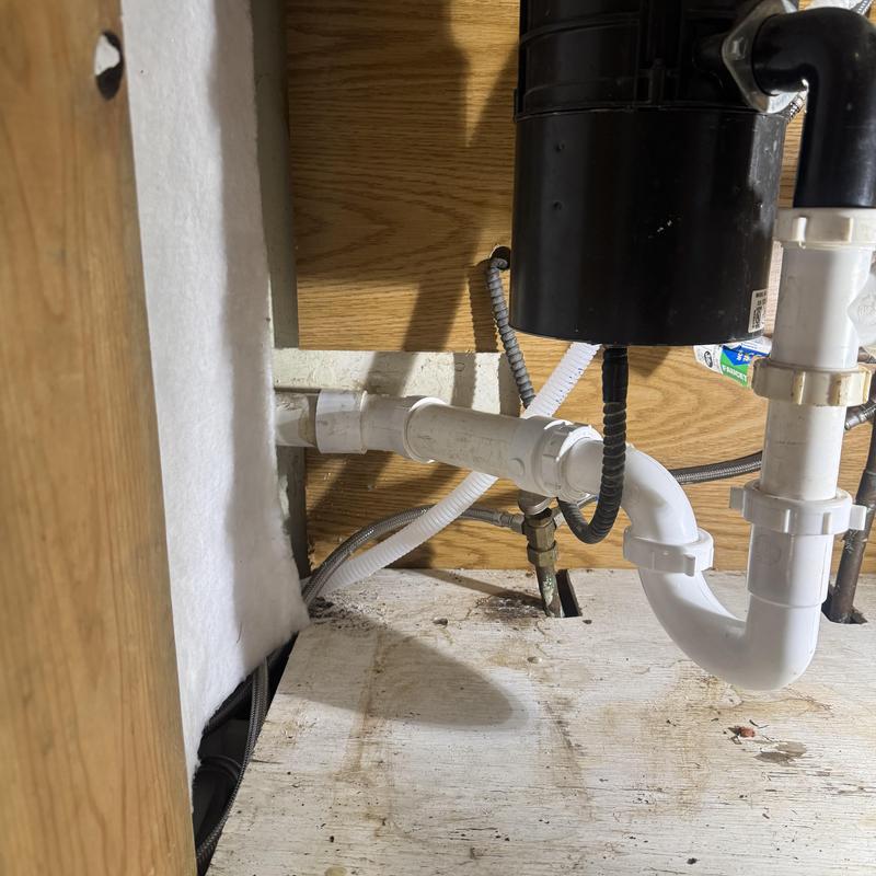 P trap and 1.5" PVC drain pipe installation under sink