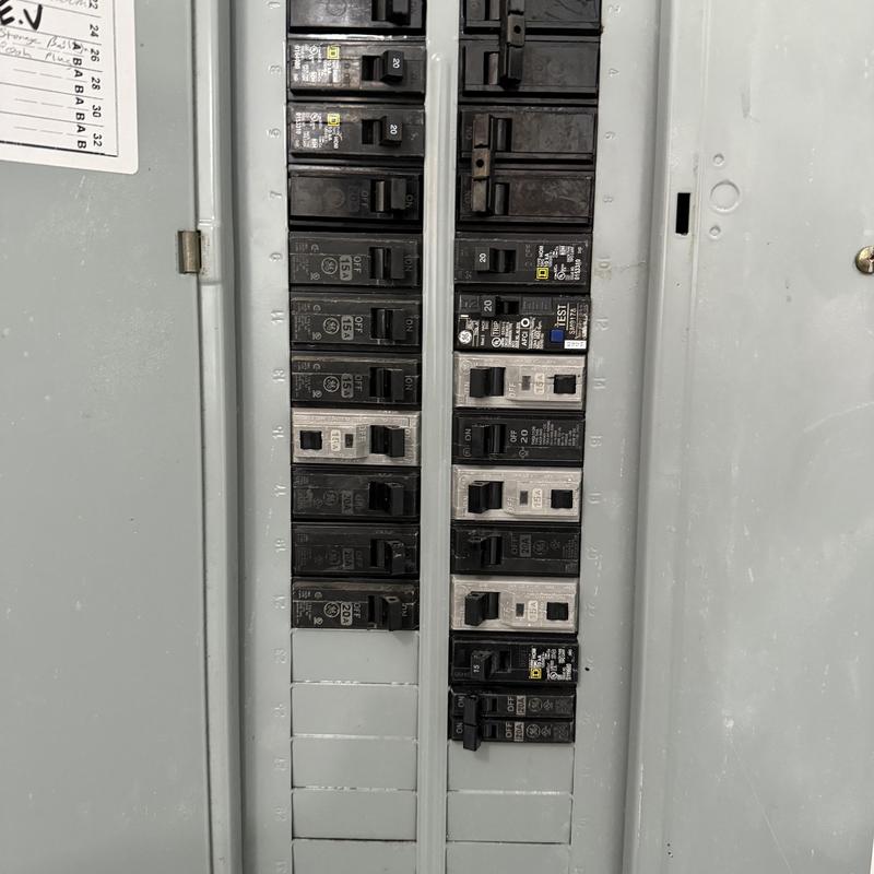 Electrical breaker panel with multiple switches and breakers