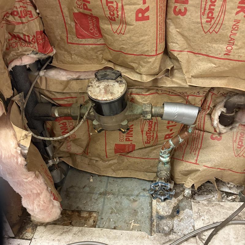 Water meter with replaced ball valve and insulation