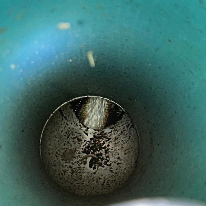 Main sewer line interior with water flushing through