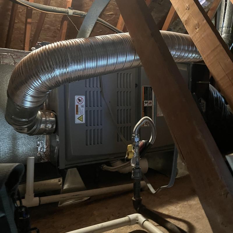 Gas furnace with flexible vent duct in attic