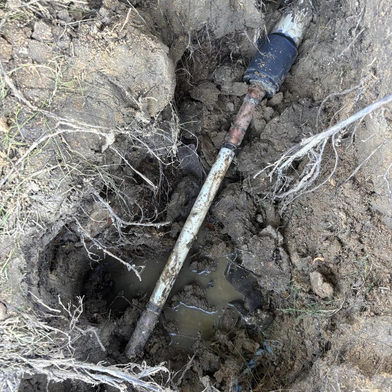 Copper and PVC main supply line with leak repair