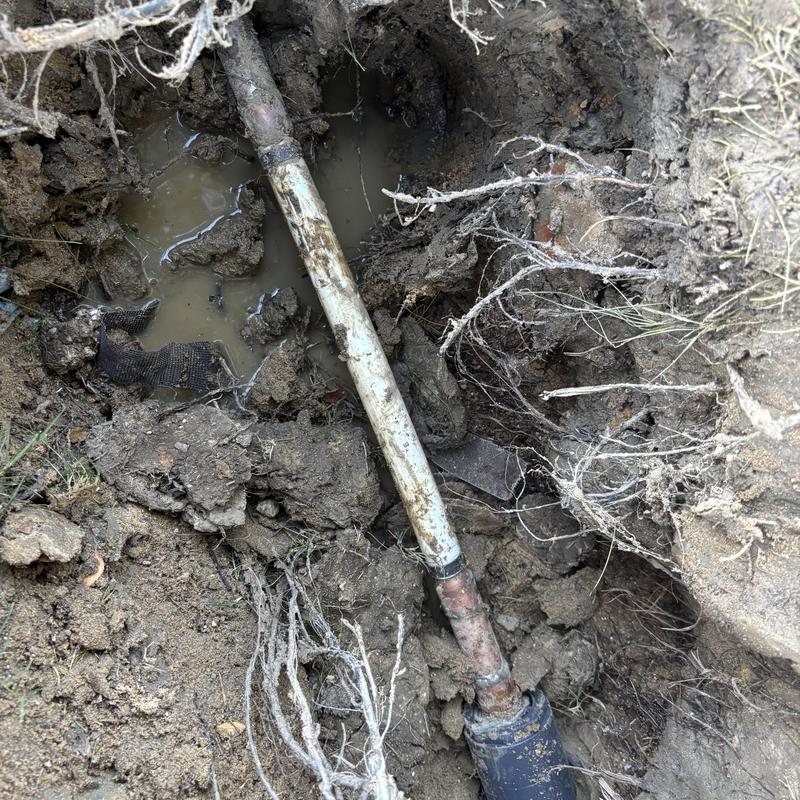 PVC and copper main water supply line in soil excavation