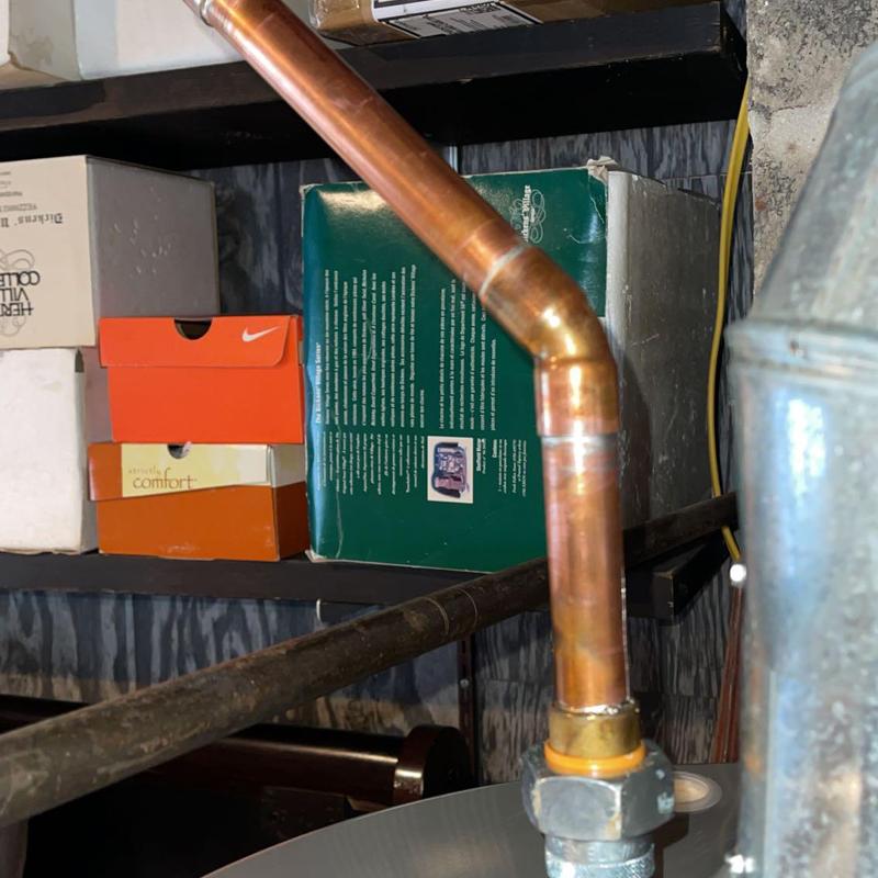 Copper gas line with elbow joint and fitting installed