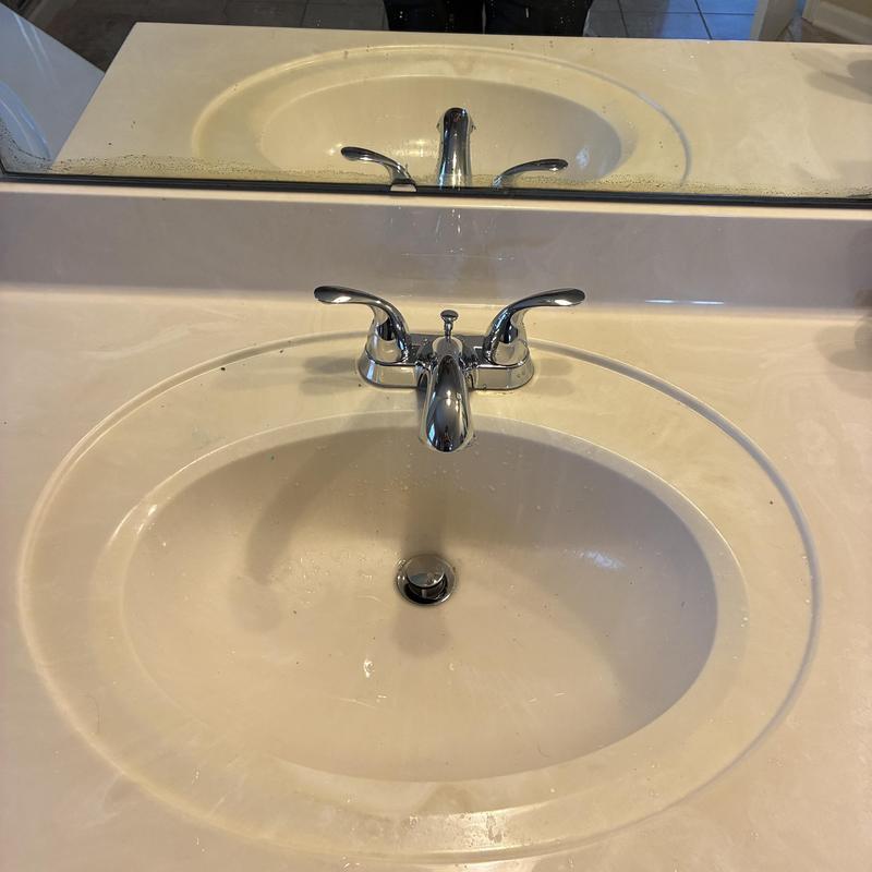 Two-handle lavatory faucet on bathroom sink
