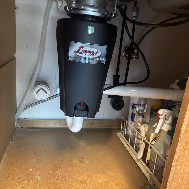 Luxury Line garbage disposal installed under sink