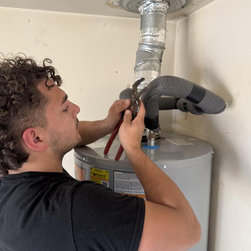 Water heater insulated pipe adjustment by technician