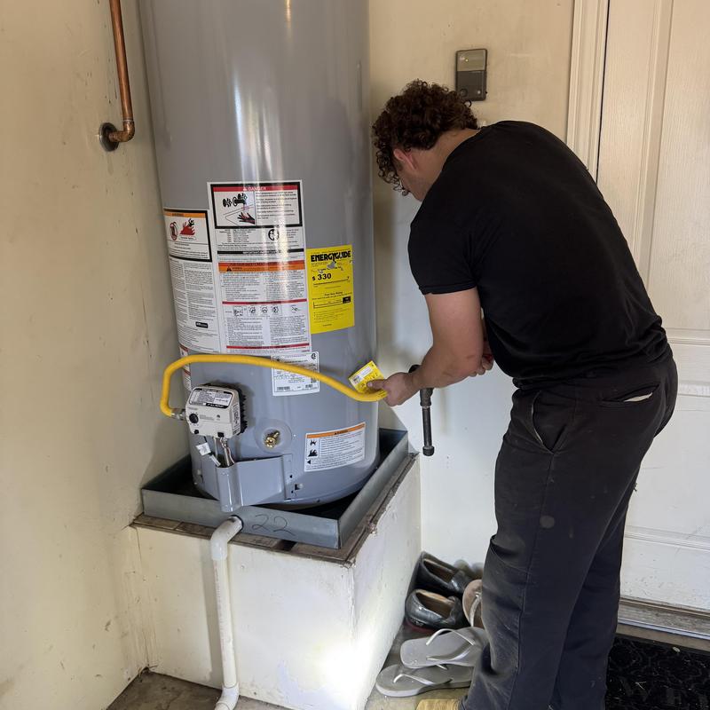 Water heater gas line inspection and pipe adjustment