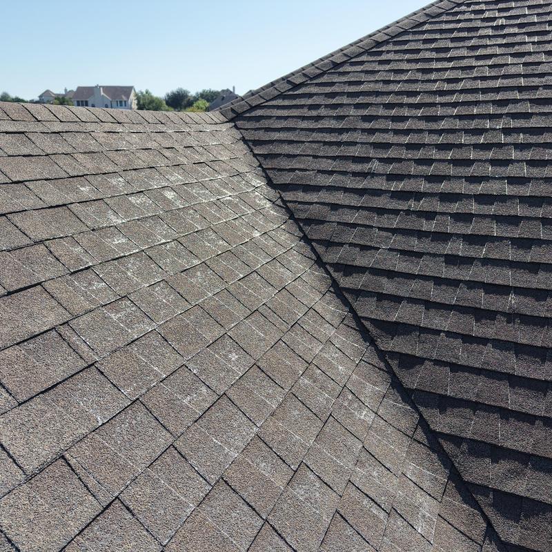 Asphalt shingles with widespread hail damage and weathering