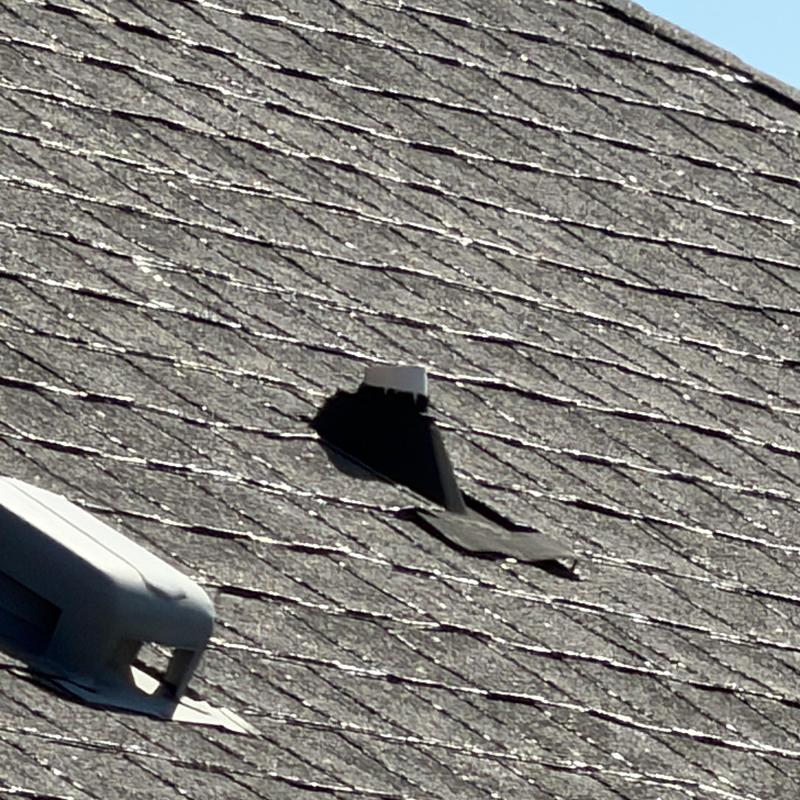 Asphalt shingle roof with large puncture hole