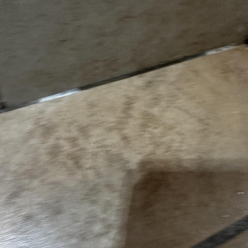 Shower drain pan with visible water damage