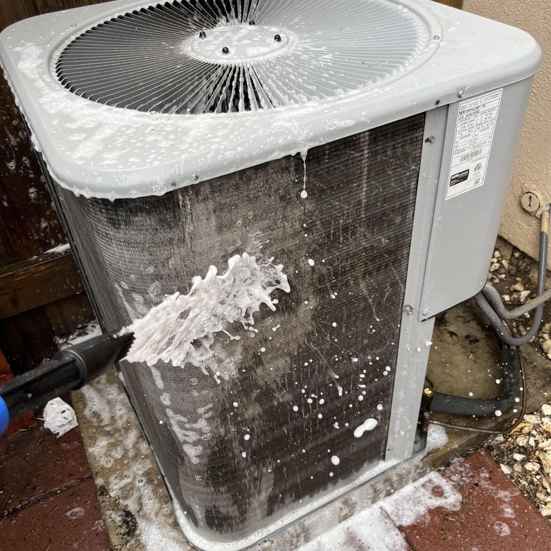 Condenser coil cleaning on outdoor AC unit