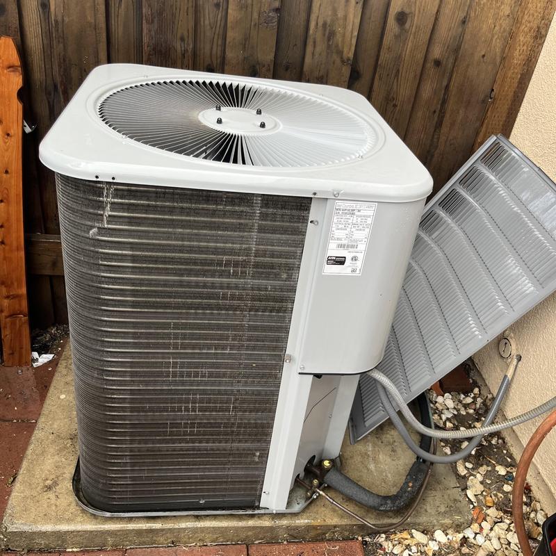 Condenser coil on HVAC unit with side panel removed