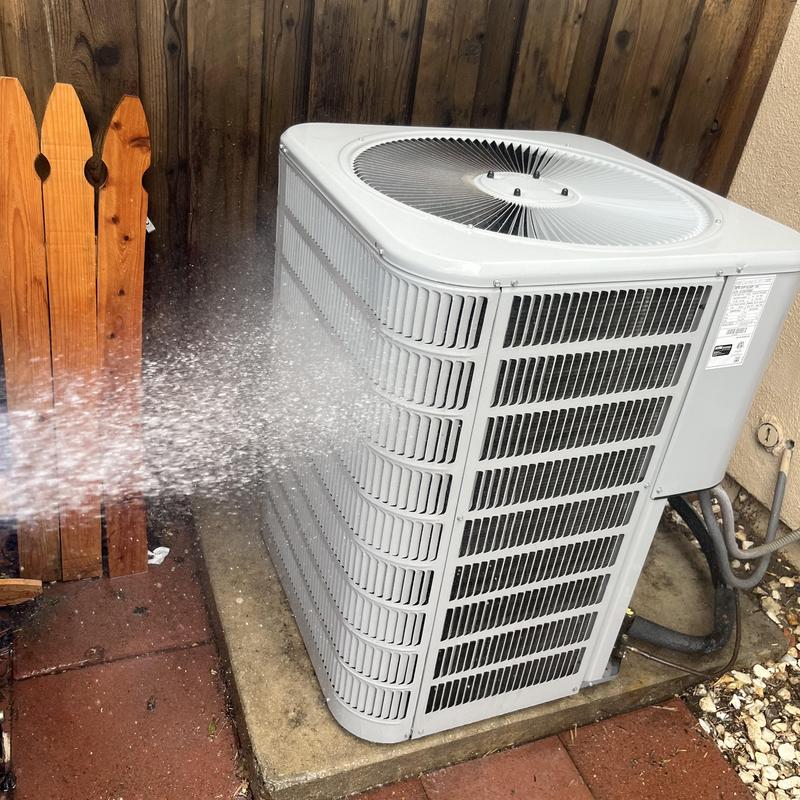 Condenser coil cleaning on outdoor AC unit