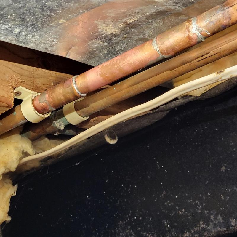 Copper water line with soldered joints under crawl space