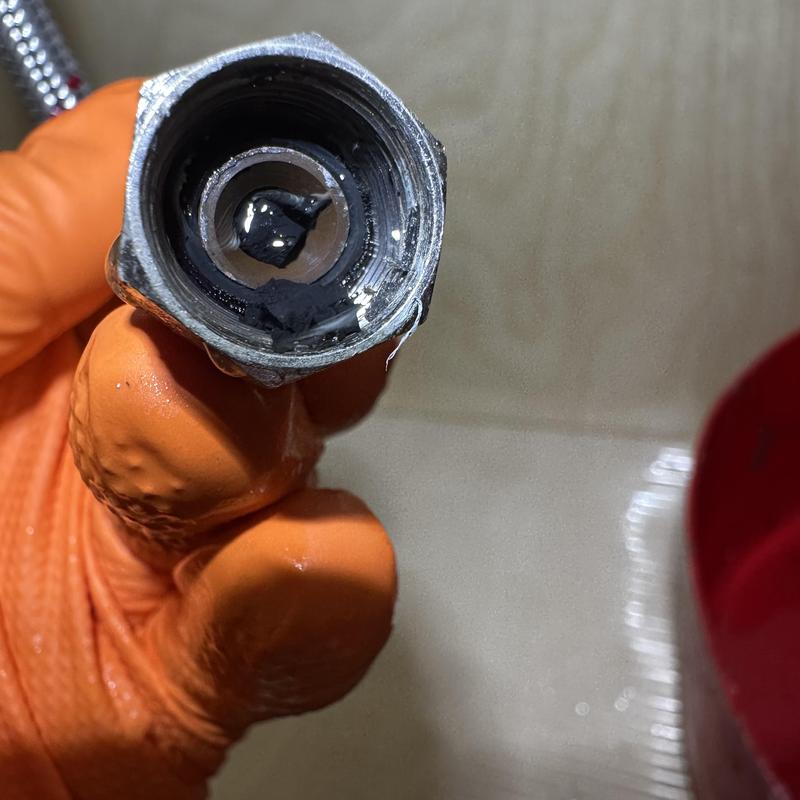 Faucet supply line clogged with rubber debris blockage