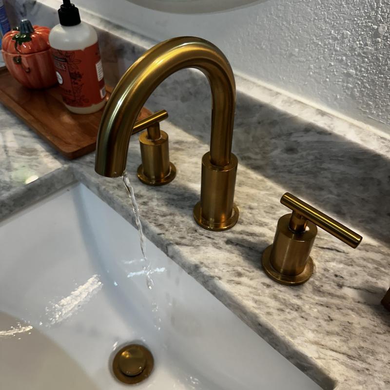 Brass faucet with water flow and clear supply line