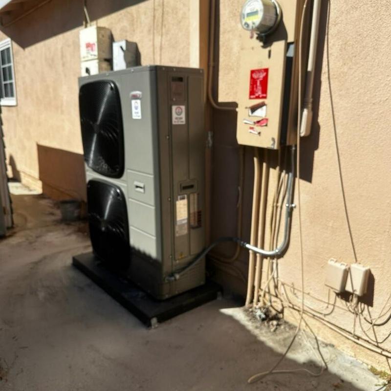 Condenser unit installation beside exterior wall and meter