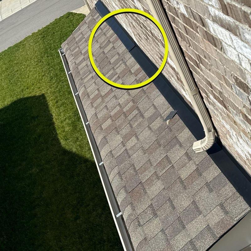 Asphalt shingles and flashing on house roof edge