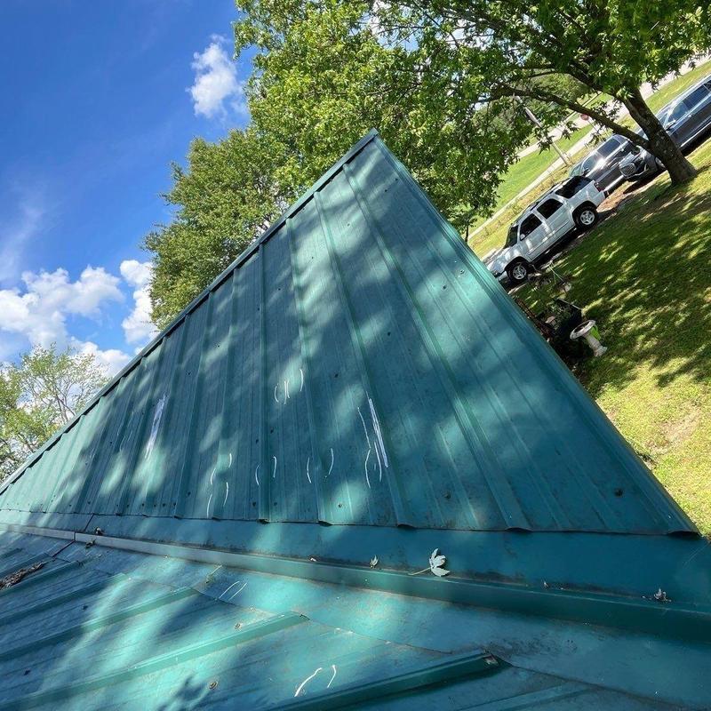 Metal roof panels with weather wear marks