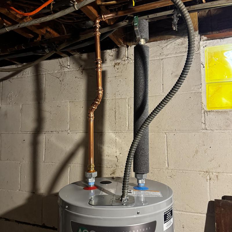 Copper pipe sweat elbow on electric water heater installation