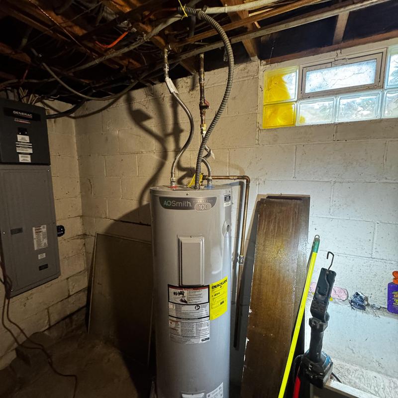 Electric water heater with new elbow and coupling installation