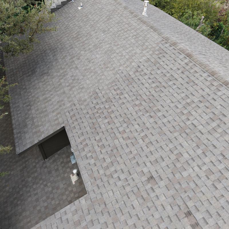 Owens Corning asphalt shingle roof with hail damage