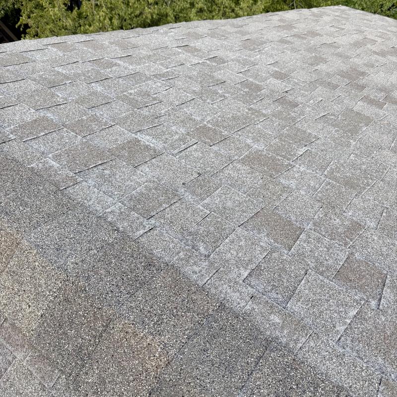 Owens Corning asphalt shingle roof hail damage close-up