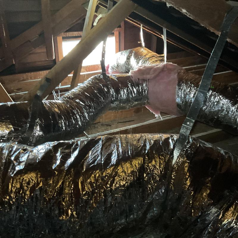 Furnace ductwork with insulation in attic space