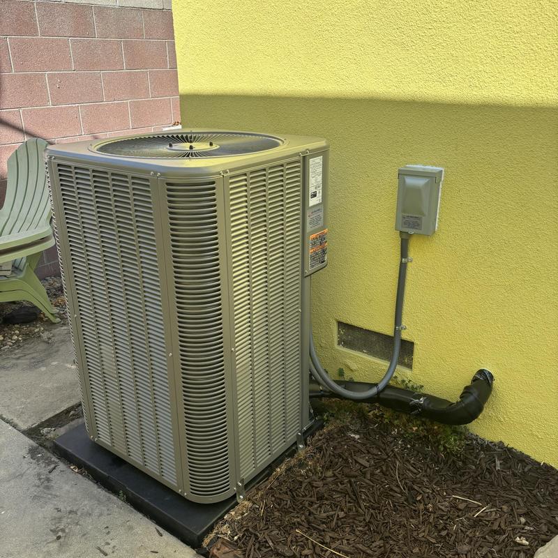 ML14KC1 condenser unit installed outdoors by wall