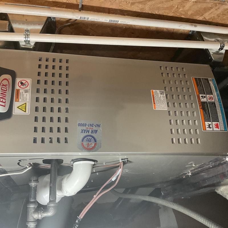 Lennox indoor furnace unit with piping and wiring