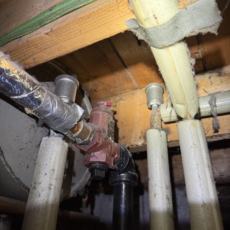 Hyvent valves in pipe system with insulation and wood beams